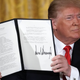 President Donald Trump holding an executive order to create the Space Force.